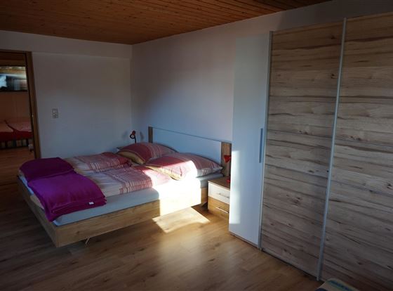 Bedroom in the Hanserhof with south-facing balcony.